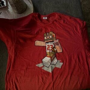 Red Christian McCaffrey T-Shirt with Pixel Art Design